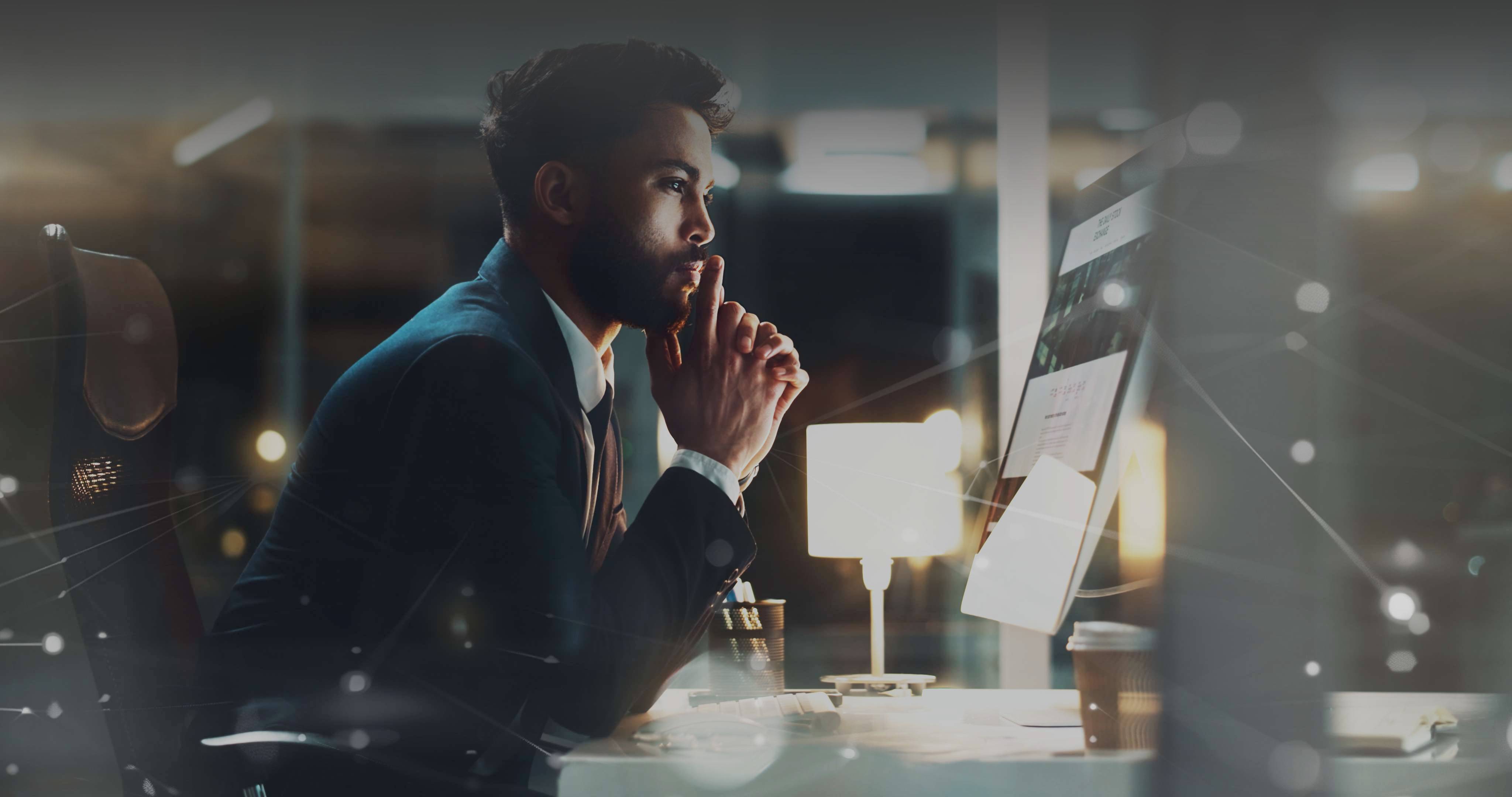 A professional analyzing information at a workstation